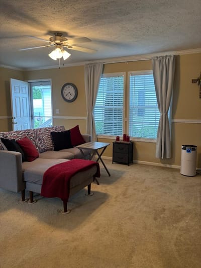 Cozy common area with a couch and natural light