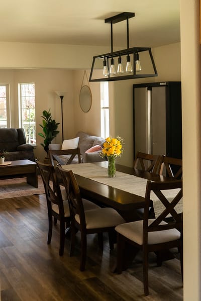 Dining area with a table and flowers