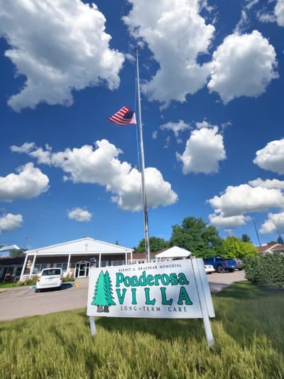 Signage and building exterior of Ponderosa Villa