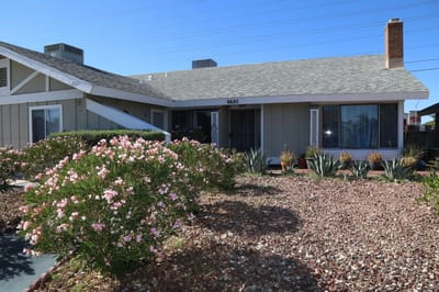 Exterior view of the facility with landscaping.