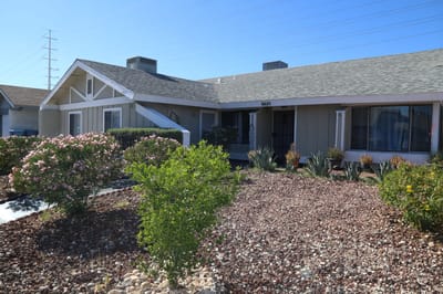 Exterior view of the facility with landscaping.