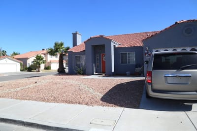 Exterior view of a house with a driveway.