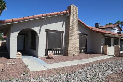 Exterior view of a single-story care home building.