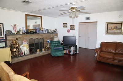Living room with fireplace and seating area.