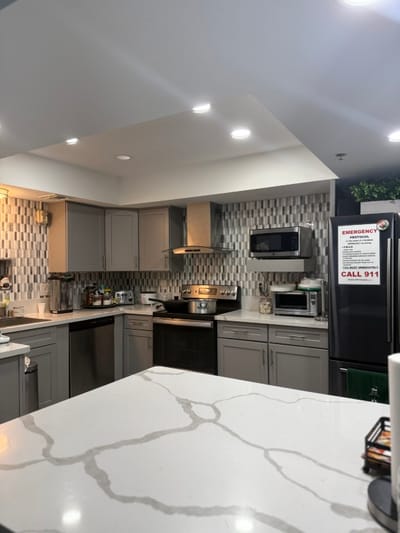 Clean kitchen area with modern appliances