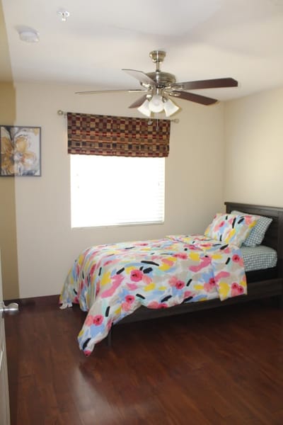 Private resident room with a floral bedspread