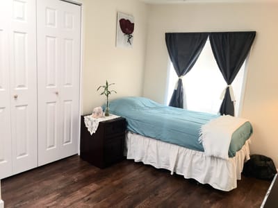 Cozy private room with a bed and window