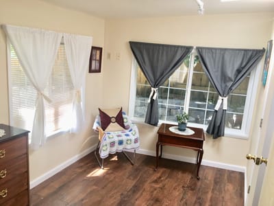 Bright interior room with seating and curtains
