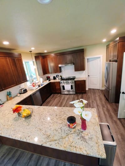 Modern kitchen with granite countertops and cabinets