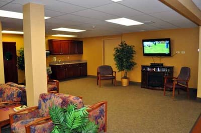 Bright common area with seating and TV