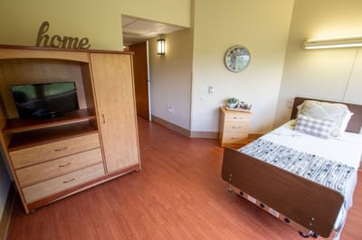 Cozy private resident room with wooden furniture