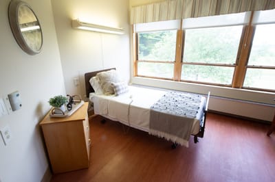 Cozy resident room with a bed and natural light