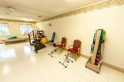 Therapy room with exercise equipment and chairs