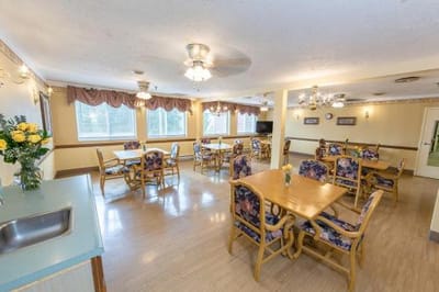 Common area with dining tables and flowers