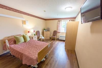 Comfortable private resident room with a bed and decor