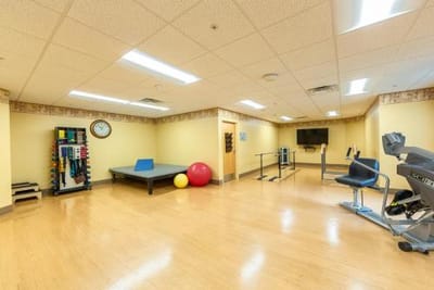 Therapy room with exercise equipment and balls