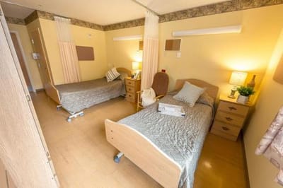 Interior view of a shared resident room with two beds