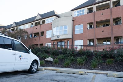 Exterior view of Valley View Village with facility van