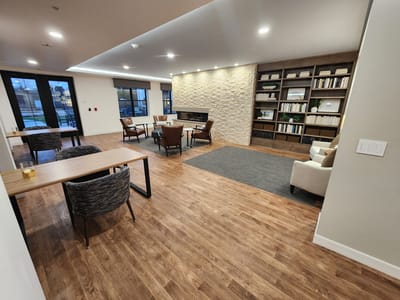 Bright common area with seating and bookshelves