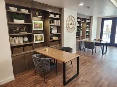 Bright common area with tables and decor
