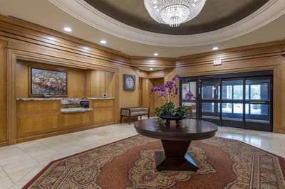 Interior view of a welcoming lobby with decorative flowers
