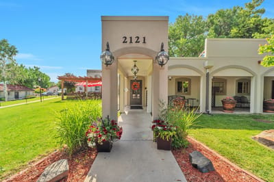 Entrance of a senior living facility with landscaping