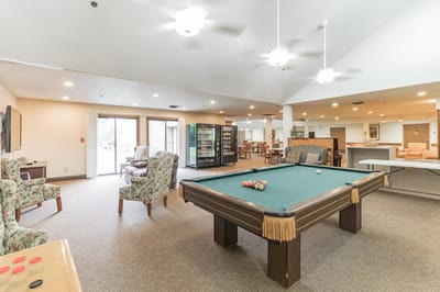 Common area with a pool table and seating