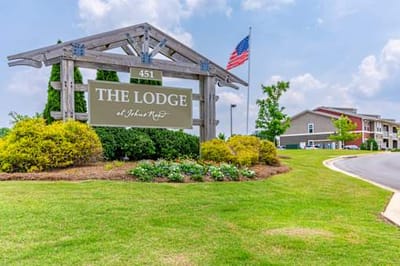 Exterior view of The Lodge at Johns Rd with signage