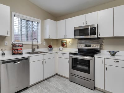 Bright kitchen with modern appliances and cabinetry