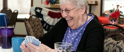 Resident enjoying a card game in a common area