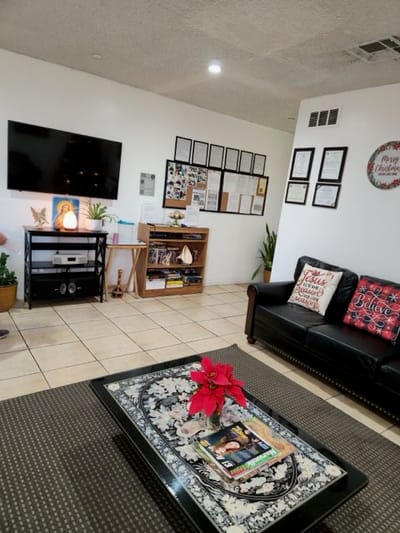 Common area in a senior living facility with seating and decorations