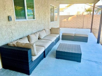 Outdoor seating area with a patio couch and coffee table