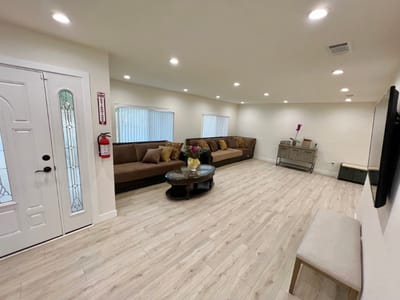 Bright common area with comfortable seating and decor