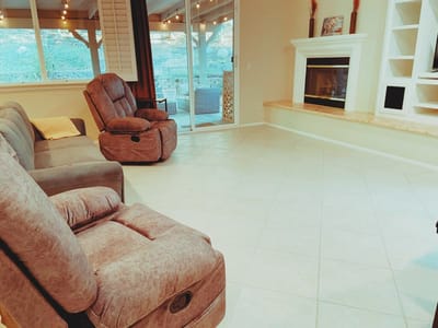 Cozy common area with recliners and fireplace
