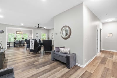 Bright common area with seating and dining space