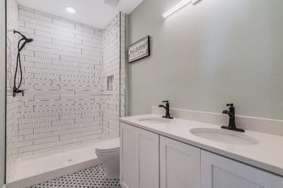 Modern bathroom interior with shower and sinks