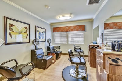 Beauty salon area with styling chairs and mirrors