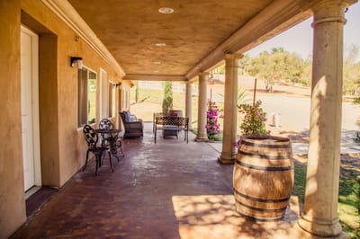 Covered outdoor seating area with flowers