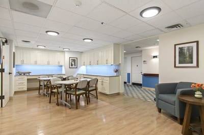 Bright interior common area with seating and tables