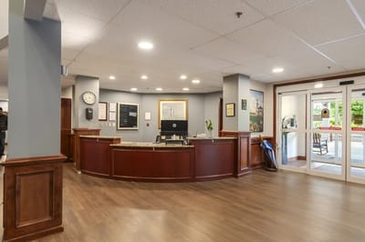 Lobby area with wood paneling and reception desk