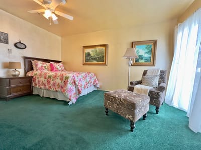 Brightly decorated resident room with floral accents