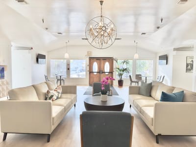 Bright common area with comfortable seating and decor