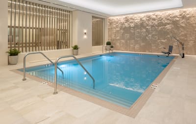 Indoor pool area with warm lighting