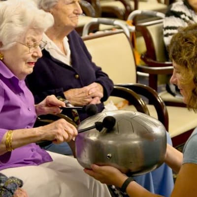 Residents engaged in a music activity session