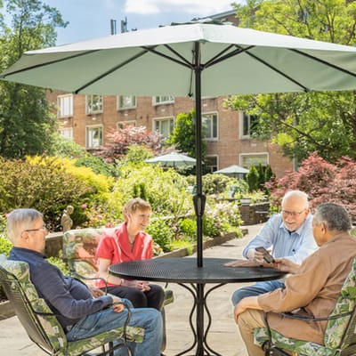 Residents enjoying time in the outdoor garden area.