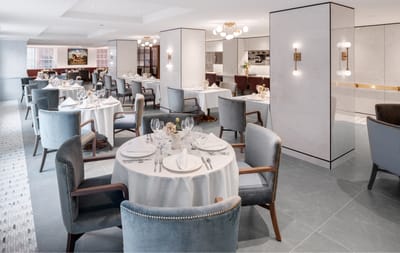 Elegant dining room setup with tables and chairs