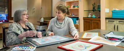 Residents and staff engaging in an art activity