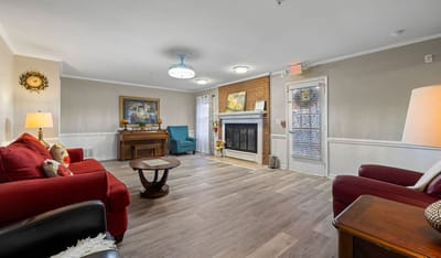 Cozy common area with comfortable seating and a fireplace.
