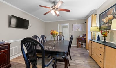 Dining area with a table, chairs, and decor.