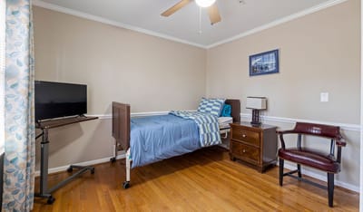 Private resident room with bed and furnishings.